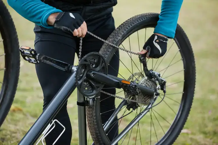 Man installing bicycle chain